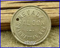 1910 MANHATTAN NV (GHOST TOWN NYE CO) NEVADA SALOON WHITE METAL 25c var. TOKEN