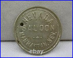 1910 MANHATTAN NV (GHOST TOWN NYE CO) NEVADA SALOON WHITE METAL 25c var. TOKEN